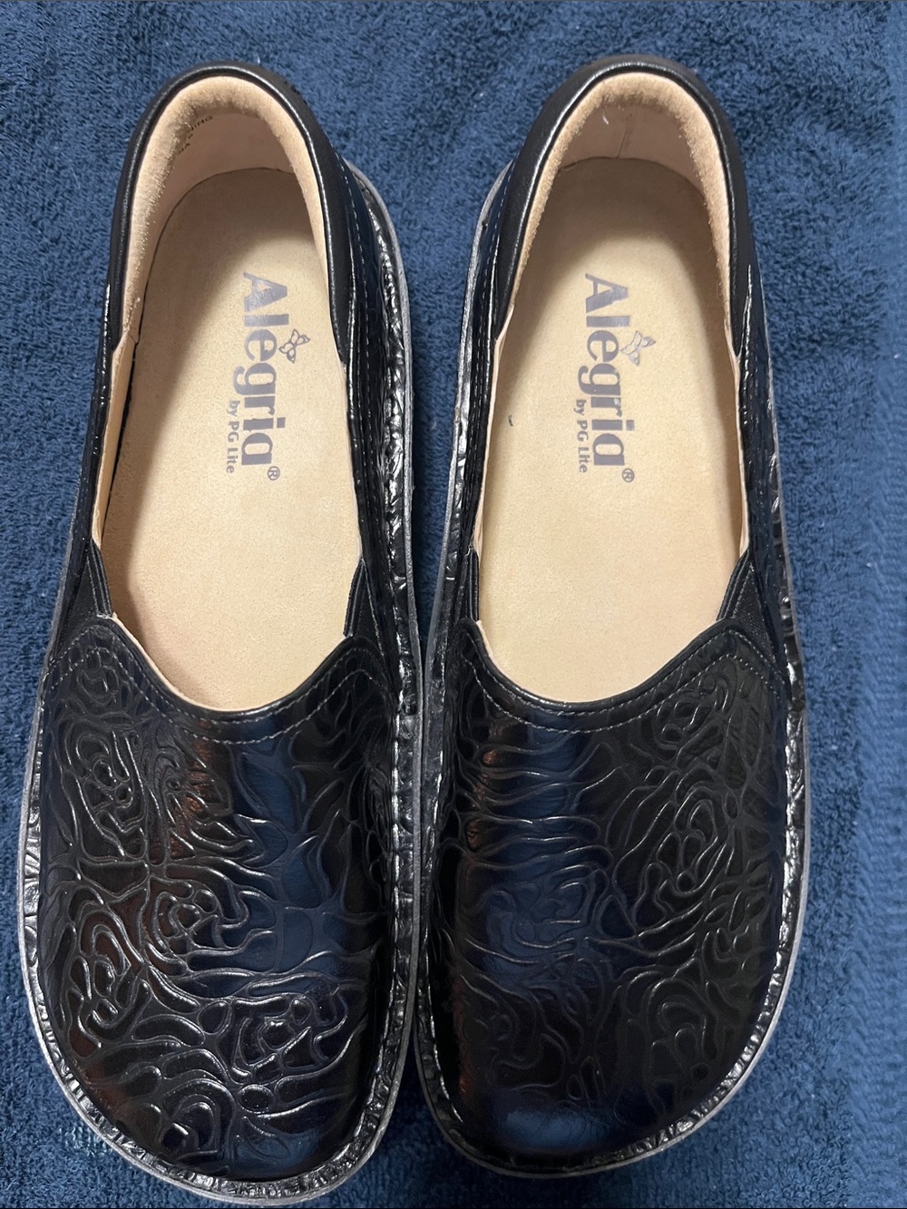 Alegria Black Embossed Slip-On shoes